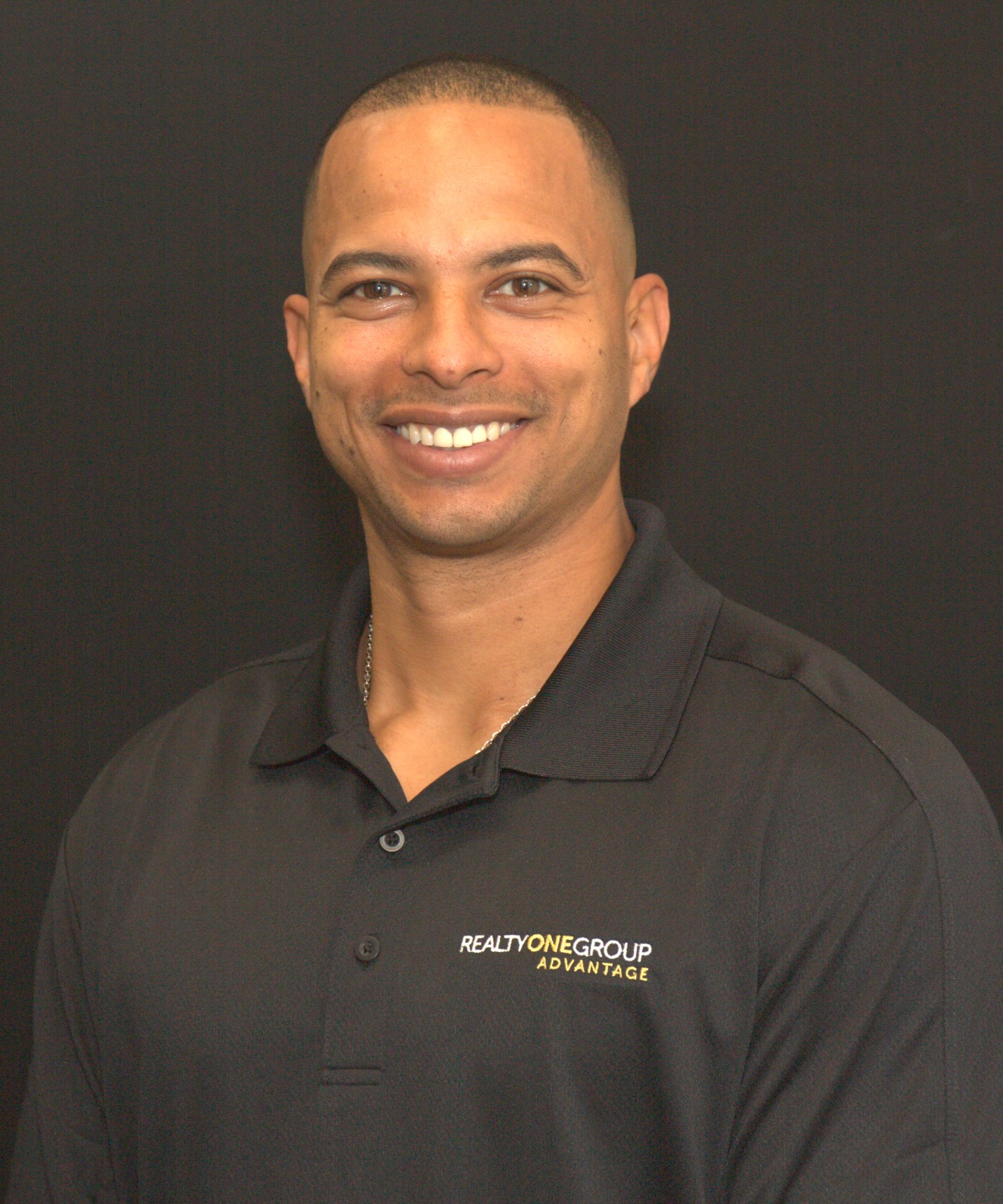 Eddy Gibbs wearing a Realty ONE Group Advantage shirt